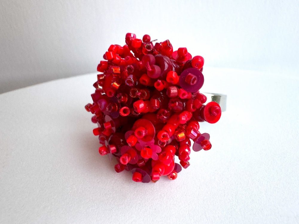 Handmade volume-beaded statement ring with floral design, polymer clay & sequins in red hues - Ornamentico shop