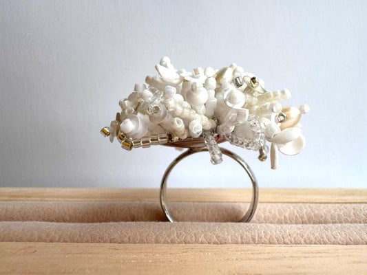 Handmade volume-beaded statement ring with floral design in white hues - Ornamentico shop