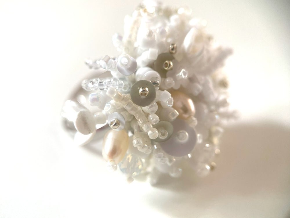 Handmade volume-beaded statement ring with floral design in white hues - Ornamentico shop