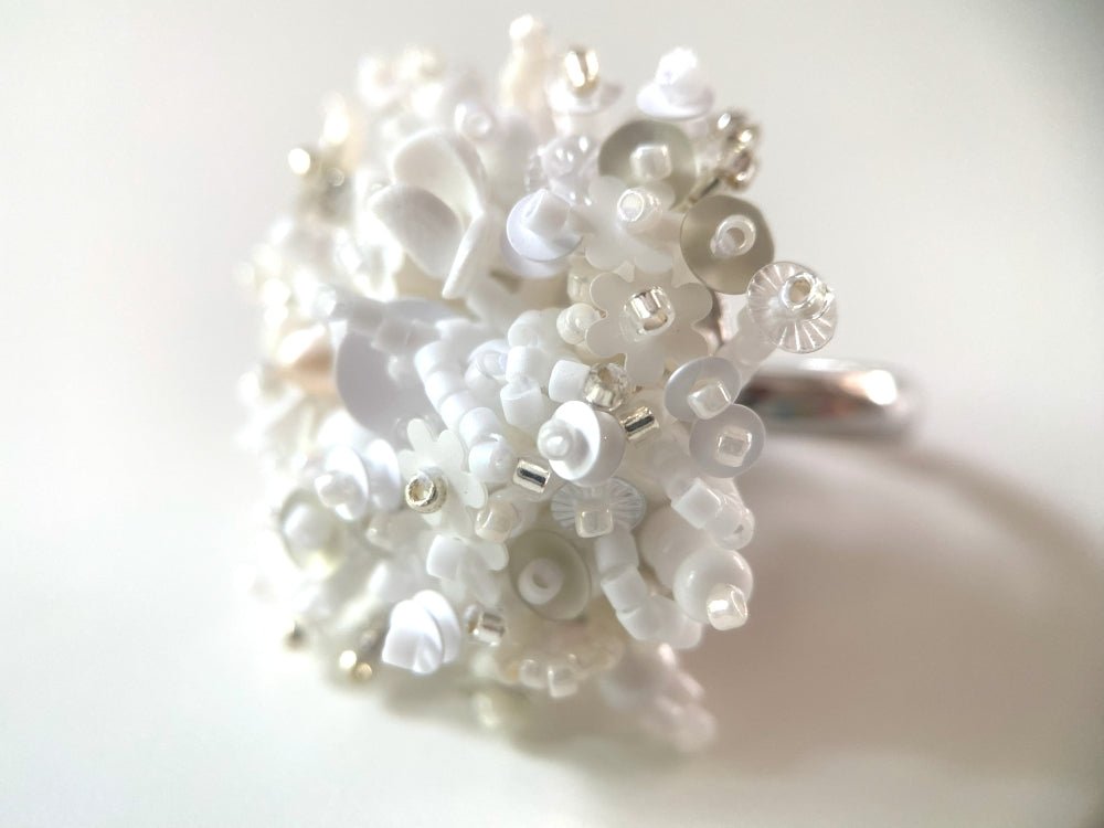 Handmade volume-beaded statement ring with floral design in white hues - Ornamentico shop