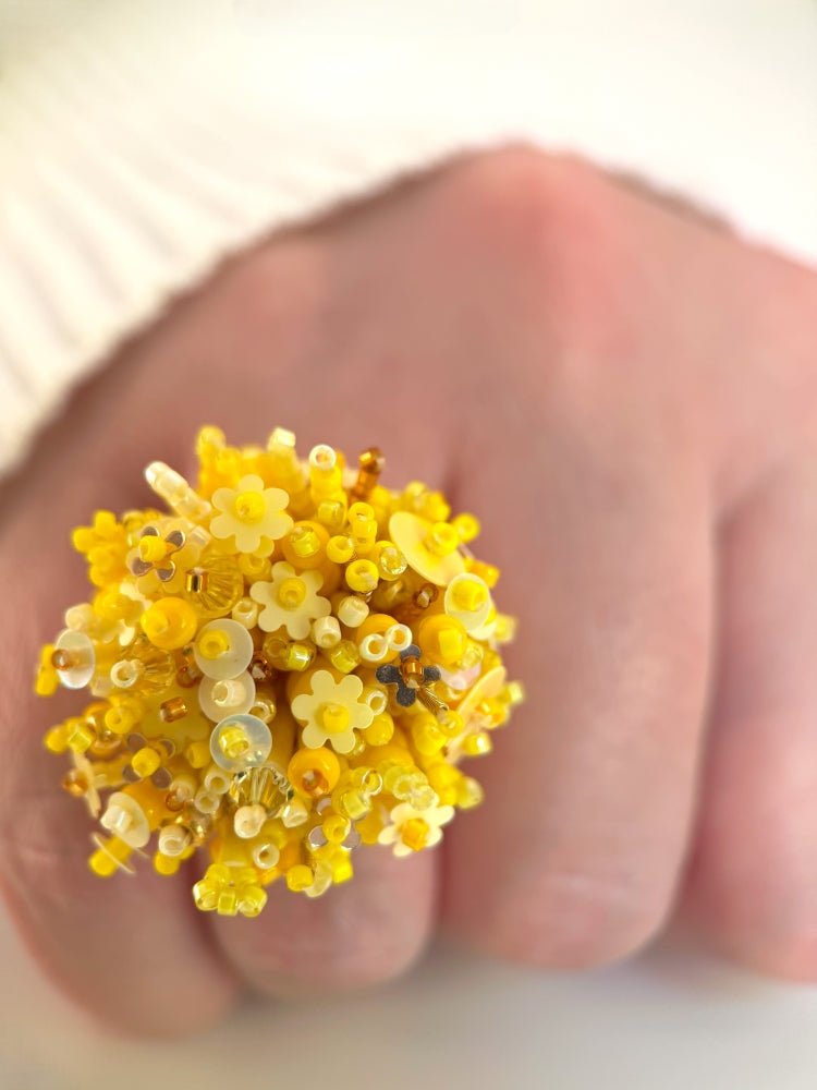 Handmade volume-beaded statement ring with floral design, polymer clay and sequins in yellow hues - Ornamentico shop