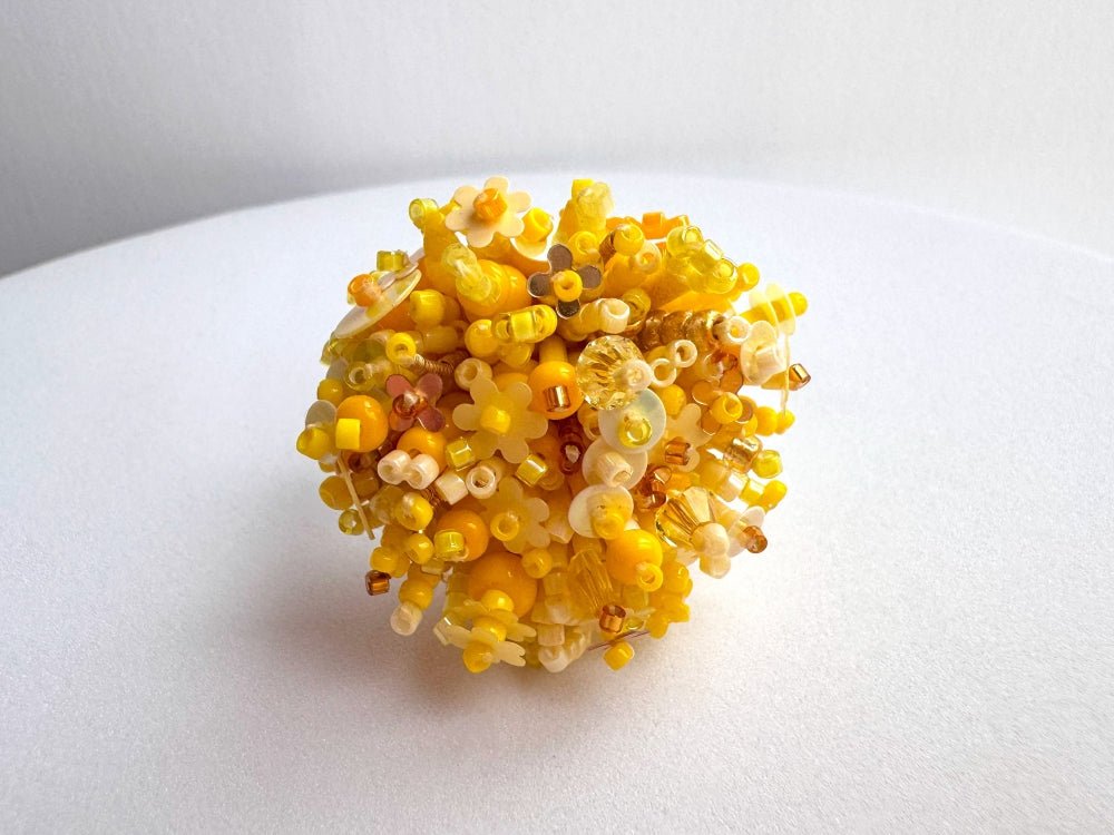 Handmade volume-beaded statement ring with floral design, polymer clay and sequins in yellow hues - Ornamentico shop