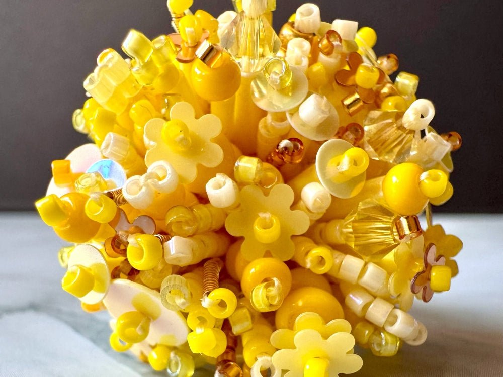 Handmade volume-beaded statement ring with floral design, polymer clay and sequins in yellow hues - Ornamentico shop