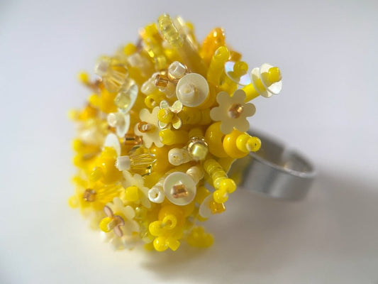 Handmade volume-beaded statement ring with floral design, polymer clay and sequins in yellow hues - Ornamentico shop