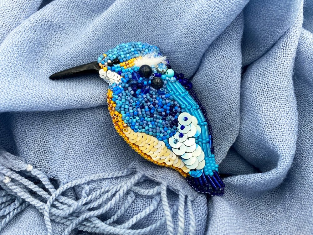 Handmade beaded brooch in the shape of a kingfisher made from glass beads, sequins, bugle beads and rhinestones