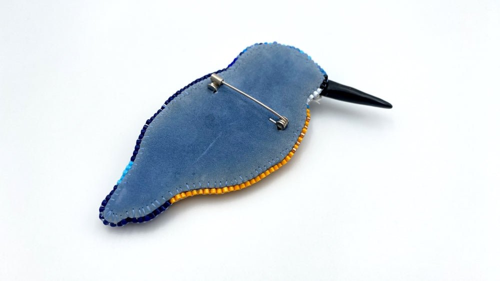 Handmade beaded brooch in the shape of a kingfisher made from glass beads, sequins, bugle beads and rhinestones