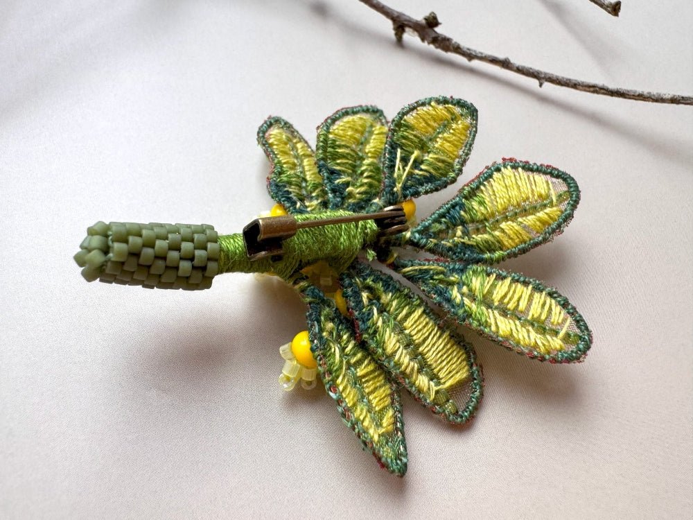Handmade beaded and embroidered brooch with beaded leaves and yellow mimosa-inspired flowers - Ornamentico shop