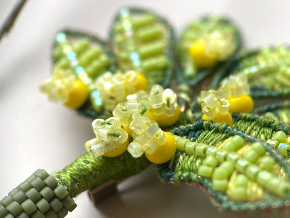 Handmade beaded and embroidered brooch with beaded leaves and yellow mimosa-inspired flowers - Ornamentico shop