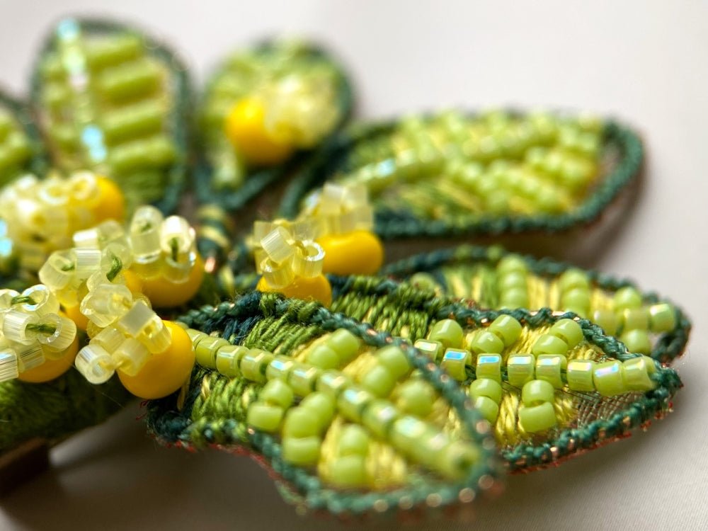 Handmade beaded and embroidered brooch with beaded leaves and yellow mimosa-inspired flowers - Ornamentico shop