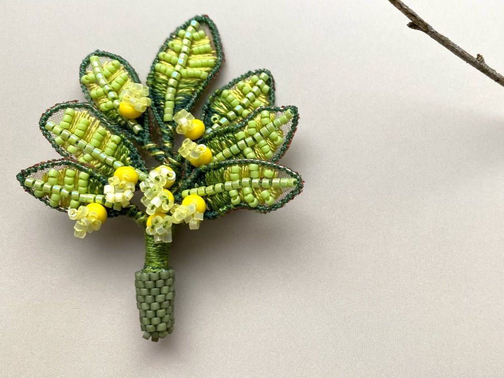 Handmade beaded and embroidered brooch with beaded leaves and yellow mimosa-inspired flowers - Ornamentico shop
