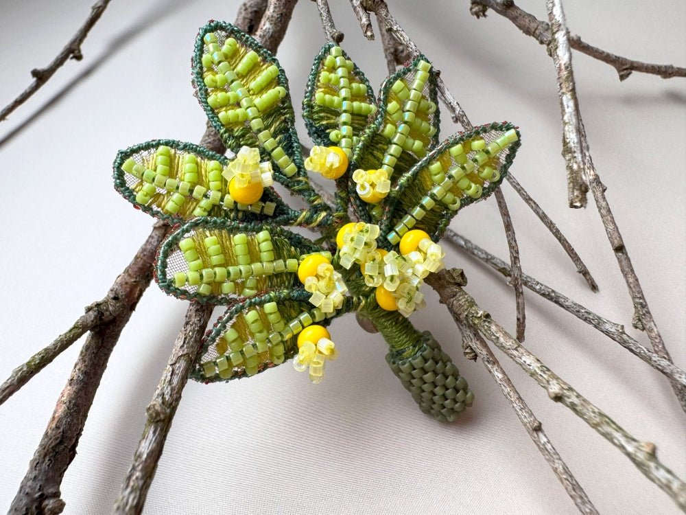 Handmade beaded and embroidered brooch with beaded leaves and yellow mimosa-inspired flowers - Ornamentico shop