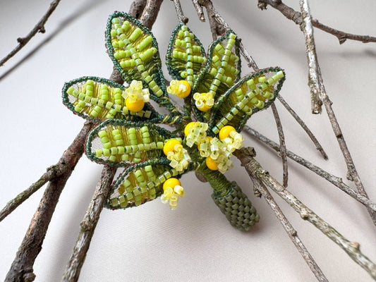 Handmade beaded and embroidered brooch with beaded leaves and yellow mimosa-inspired flowers - Ornamentico shop