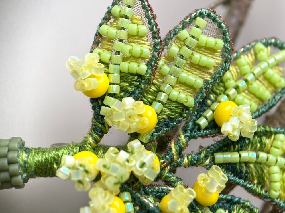 Handmade beaded and embroidered brooch with beaded leaves and yellow mimosa-inspired flowers - Ornamentico shop