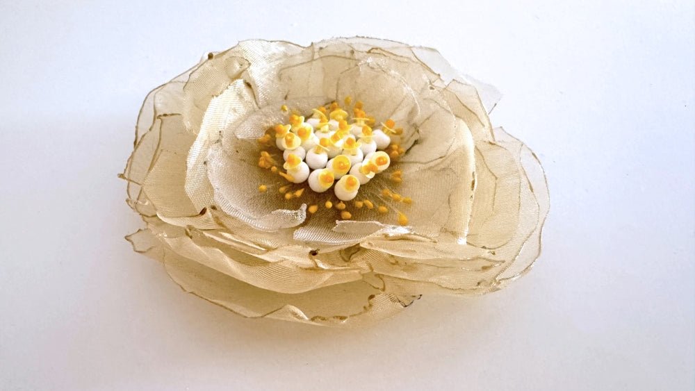 Handmade pale-yellow floral brooch crafted from organza fabric, beads and sequins