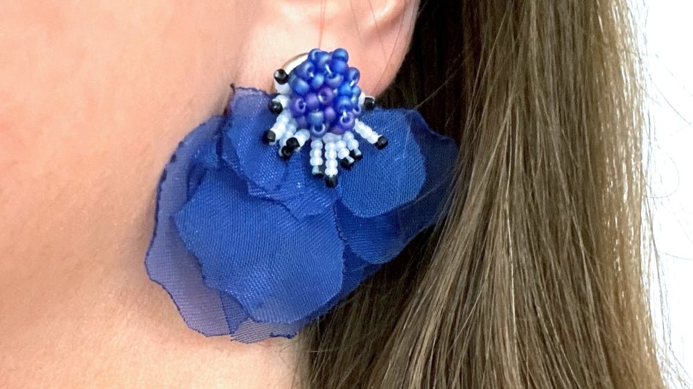 Handmade floral stud earrings in the shape of anemone flowers made from organza fabric and beads