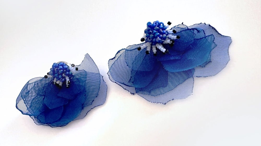Handmade floral stud earrings in the shape of anemone flowers made from organza fabric and beads