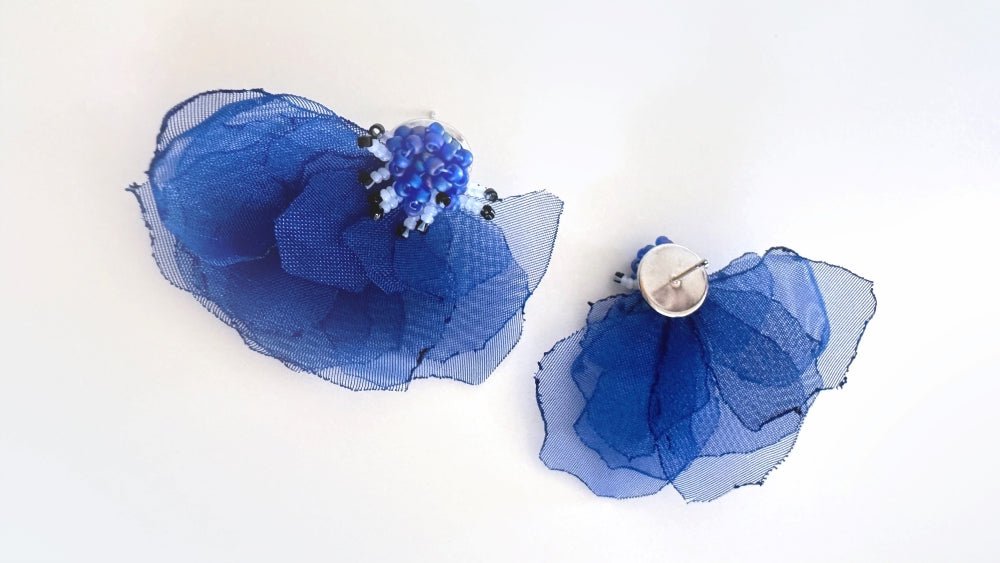 Handmade floral stud earrings in the shape of anemone flowers made from organza fabric and beads