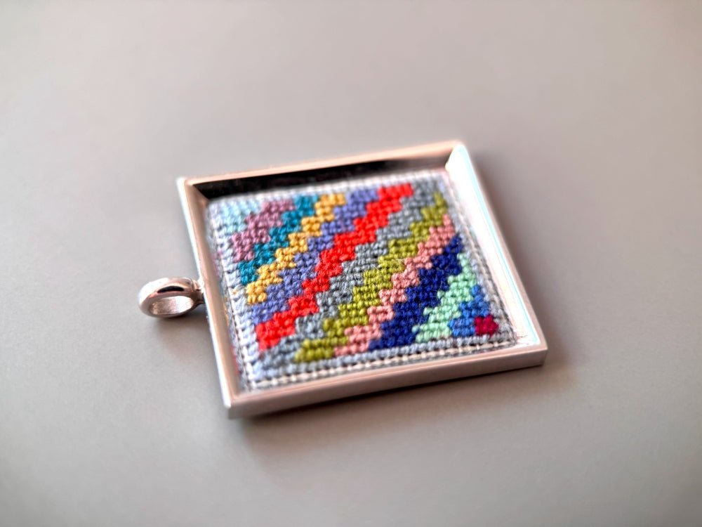 Unique hand embroidered pendant in oriental Peruvian design, set in custom silver frame - Ornamentico shop