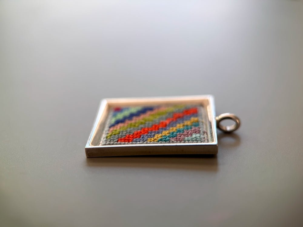 Unique hand embroidered pendant in oriental Peruvian design, set in custom silver frame - Ornamentico shop