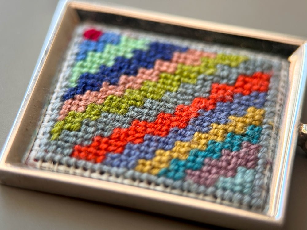 Unique hand embroidered pendant in oriental Peruvian design, set in custom silver frame - Ornamentico shop