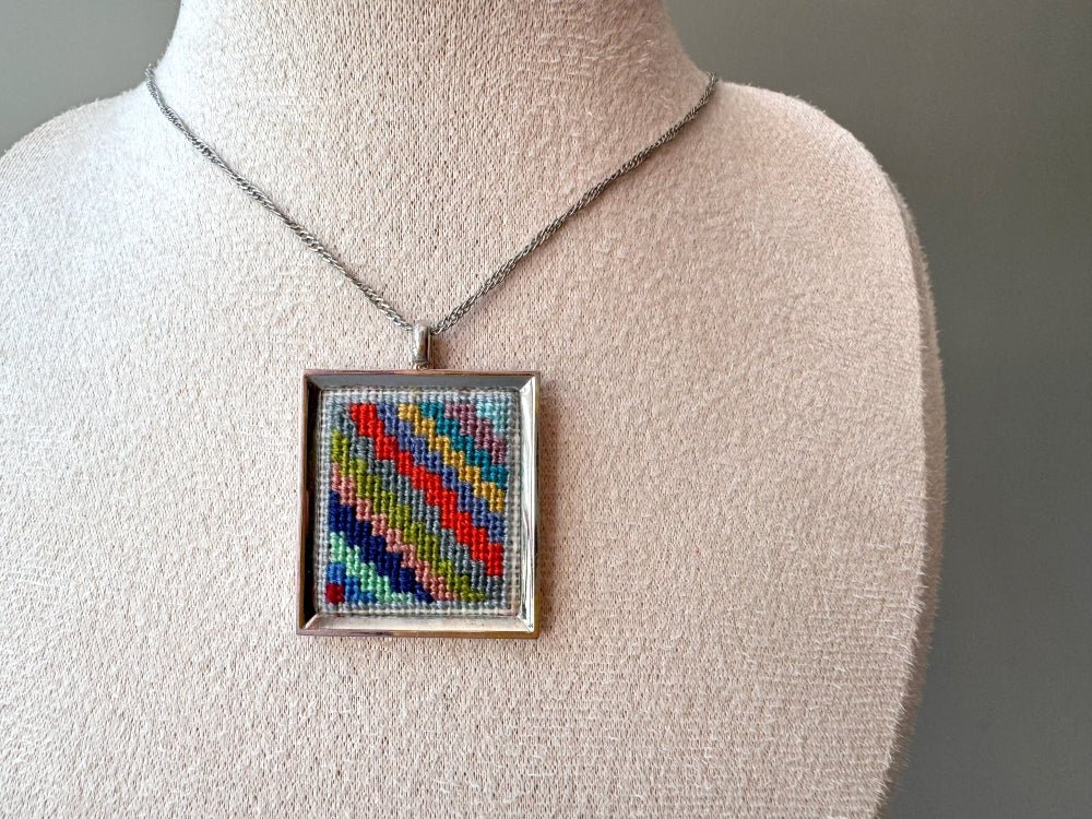 Unique hand embroidered pendant in oriental Peruvian design, set in custom silver frame - Ornamentico shop