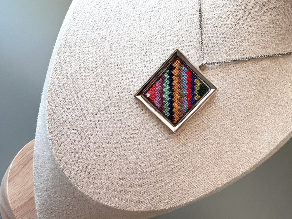 Unique hand embroidered pendant in oriental Peruvian design, set in custom silver frame - Ornamentico shop