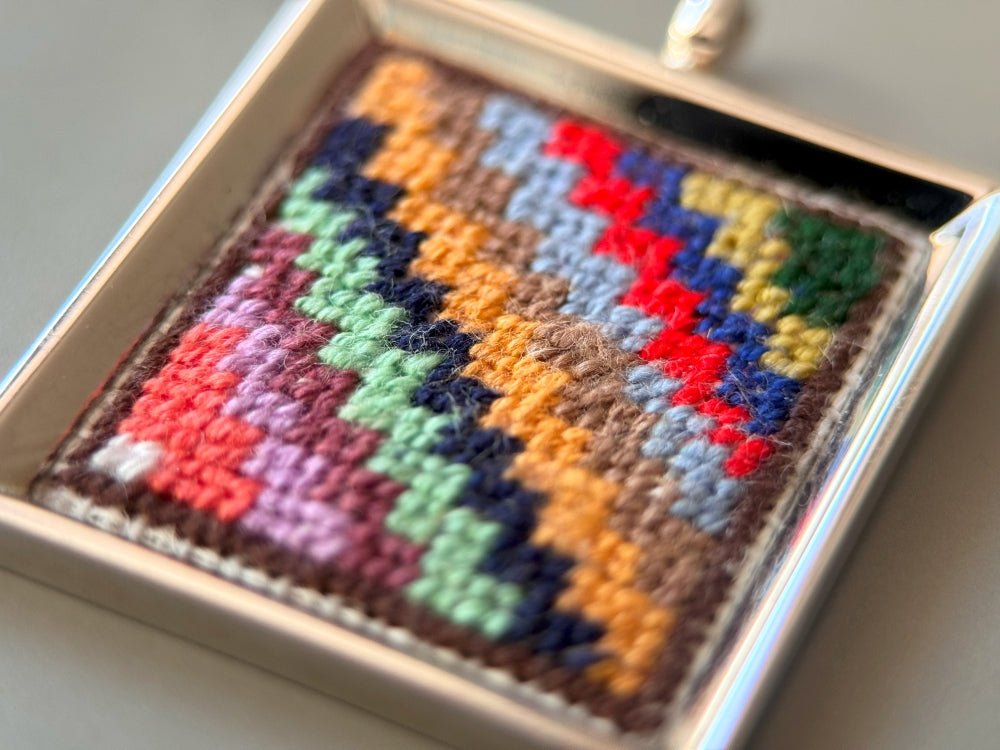 Unique hand embroidered pendant in oriental Peruvian design, set in custom silver frame - Ornamentico shop