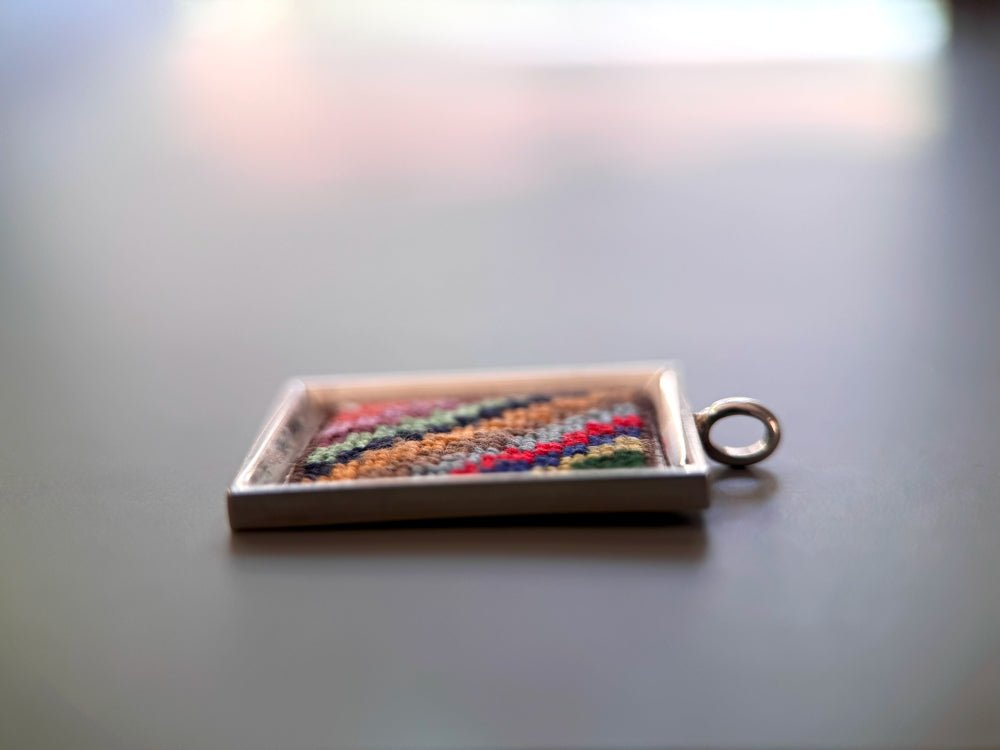 Unique hand embroidered pendant in oriental Peruvian design, set in custom silver frame - Ornamentico shop