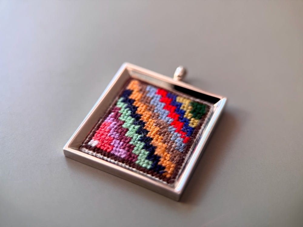 Unique hand embroidered pendant in oriental Peruvian design, set in custom silver frame - Ornamentico shop