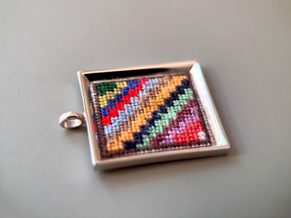 Unique hand embroidered pendant in oriental Peruvian design, set in custom silver frame - Ornamentico shop