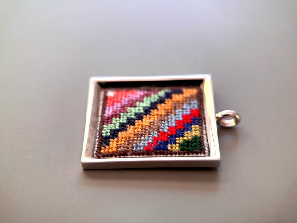 Unique hand embroidered pendant in oriental Peruvian design, set in custom silver frame - Ornamentico shop