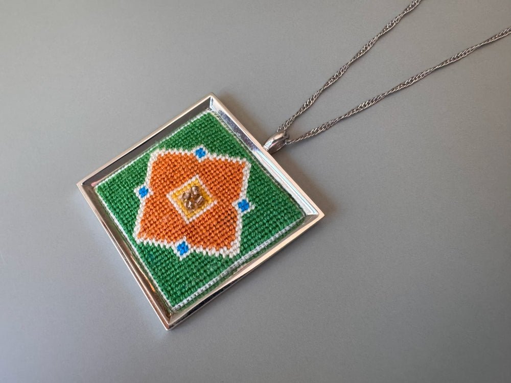 Unique hand embroidered pendant in oriental design inspired by traditional Turkish tiles and carpets, set in custom silver frame - Ornamentico shop