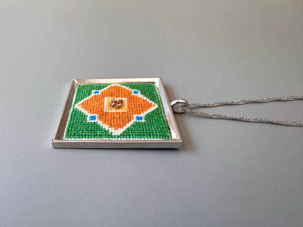 Unique hand embroidered pendant in oriental design inspired by traditional Turkish tiles and carpets, set in custom silver frame - Ornamentico shop
