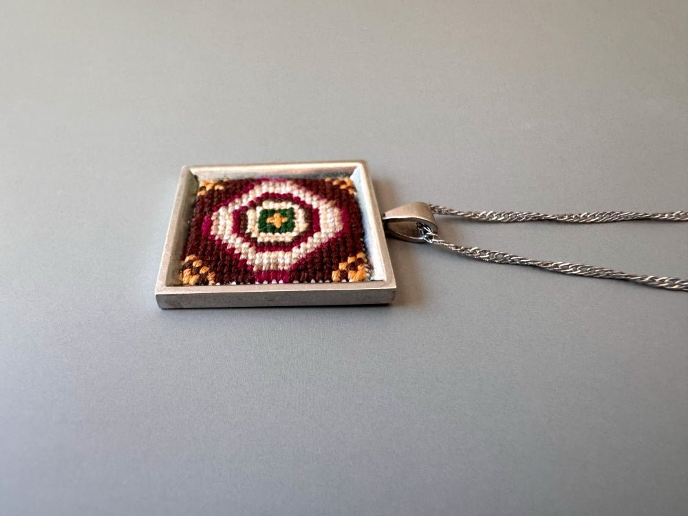 Unique pendant with delicate hand embroidery in oriental design, set in custom silver frame - Ornamentico shop