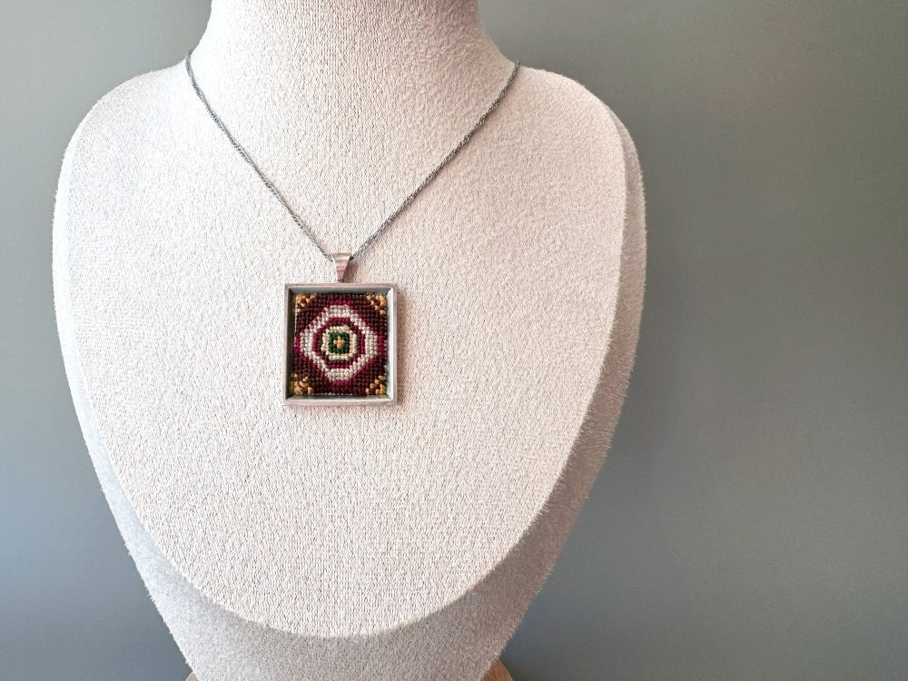 Unique pendant with delicate hand embroidery in oriental design, set in custom silver frame - Ornamentico shop