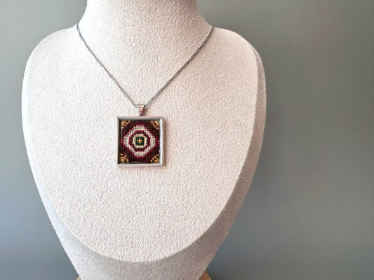 Unique pendant with delicate hand embroidery in oriental design, set in custom silver frame - Ornamentico shop