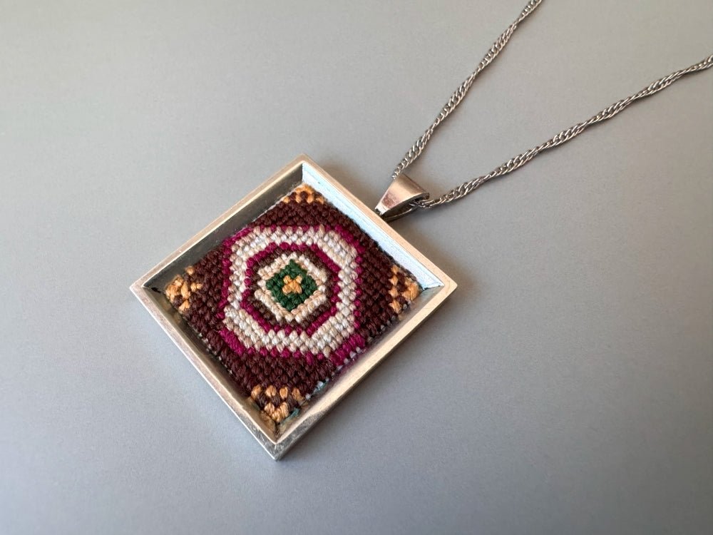 Unique pendant with delicate hand embroidery in oriental design, set in custom silver frame - Ornamentico shop
