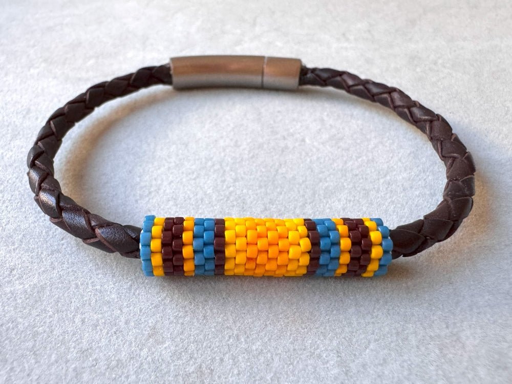 Leather bracelet from genuine brown braided leather and beaded inlay in bright orange, yellow, blue and brown colors - Ornamentico shop