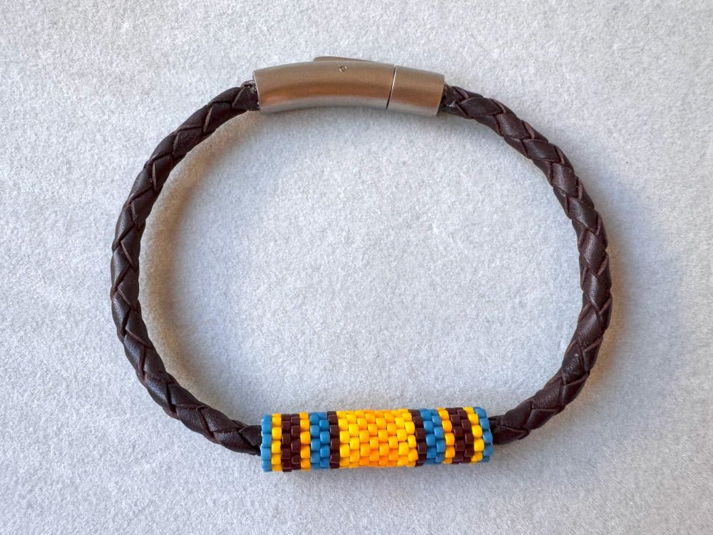 Leather bracelet from genuine brown braided leather and beaded inlay in bright orange, yellow, blue and brown colors - Ornamentico shop