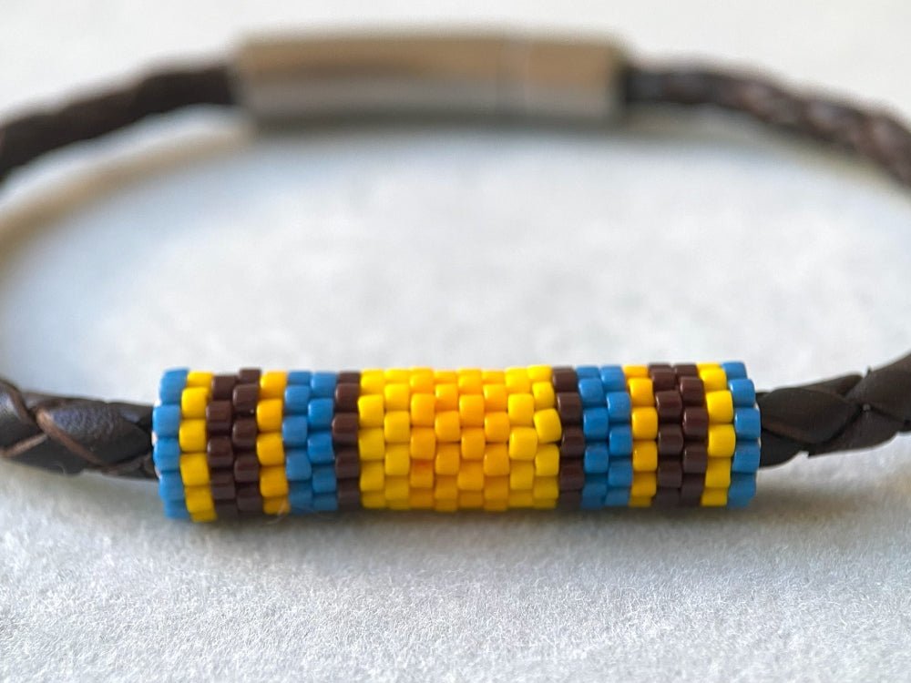 Leather bracelet from genuine brown braided leather and beaded inlay in bright orange, yellow, blue and brown colors - Ornamentico shop