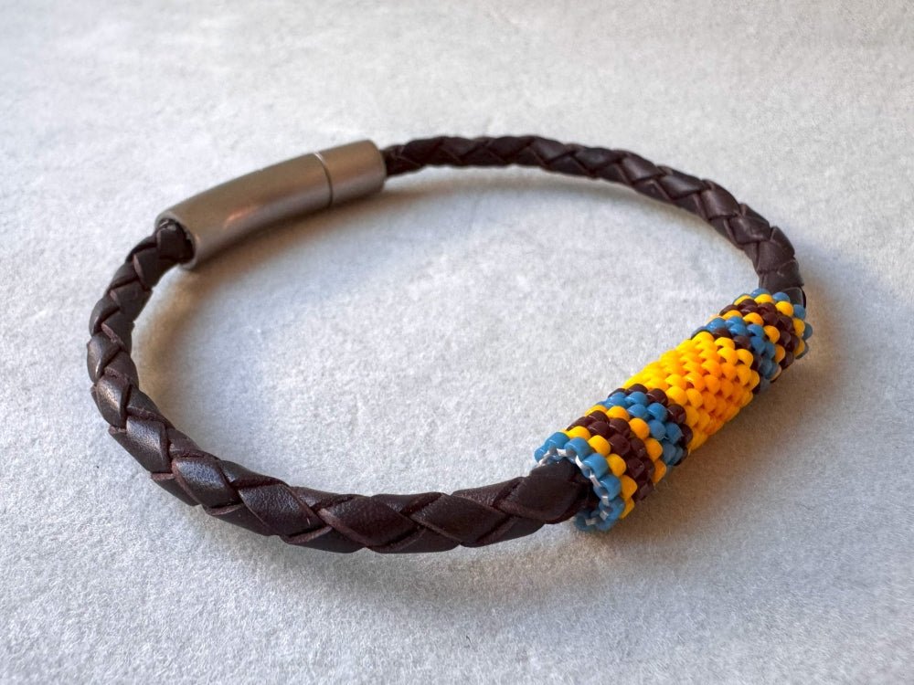 Leather bracelet from genuine brown braided leather and beaded inlay in bright orange, yellow, blue and brown colors - Ornamentico shop