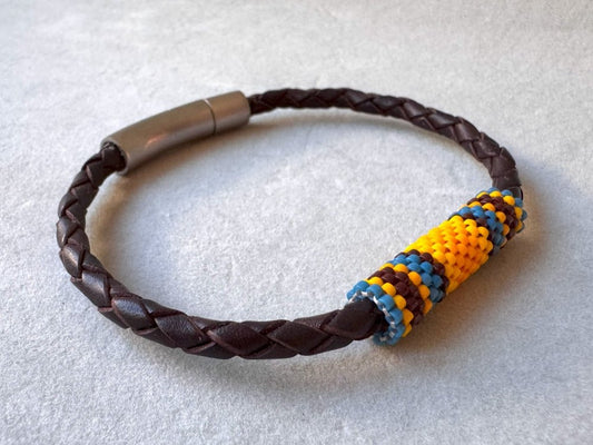 Leather bracelet from genuine brown braided leather and beaded inlay in bright orange, yellow, blue and brown colors - Ornamentico shop