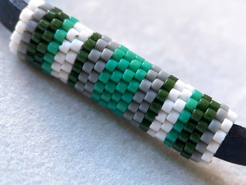 Minimalistic bracelet from black genuine leather decorated with beaded inlay in green, gray and white hues - Ornamentico shop