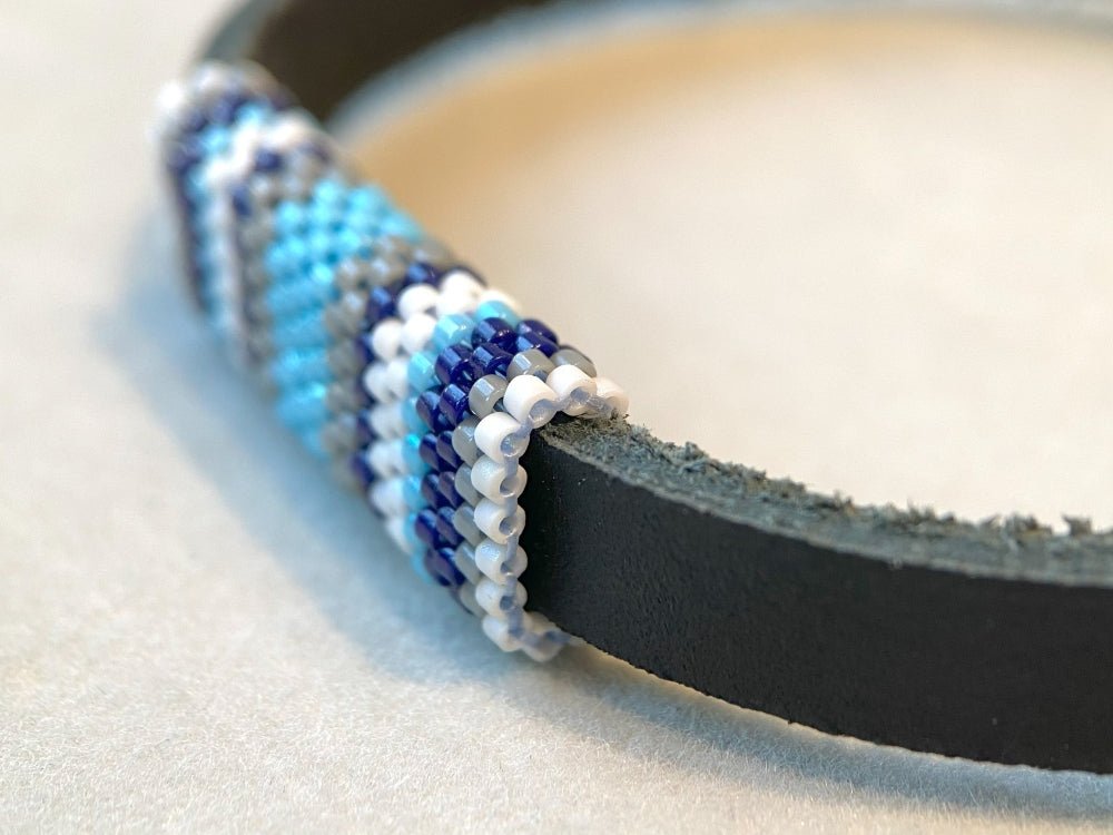 Leather bracelet with peyote stitch beaded inlay in cold blue, white and grey colors - Ornamentico shop