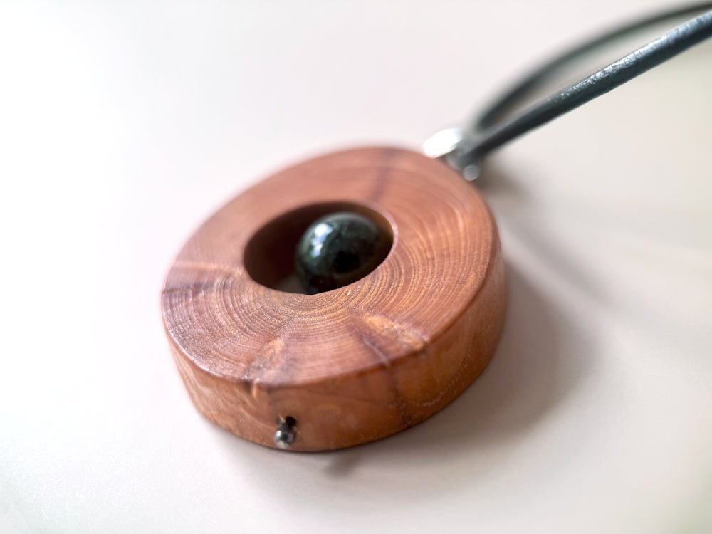 Small handmade wooden pendant with an obsidian bead - Ornamentico shop