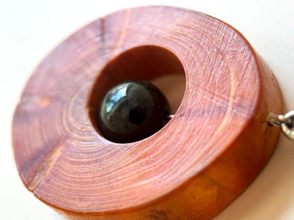 Small handmade wooden pendant with an obsidian bead - Ornamentico shop