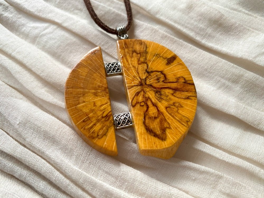 Medium size wooden pendant made from finely polished wood with silver inlays on a woven leather strap - Ornamentico shop