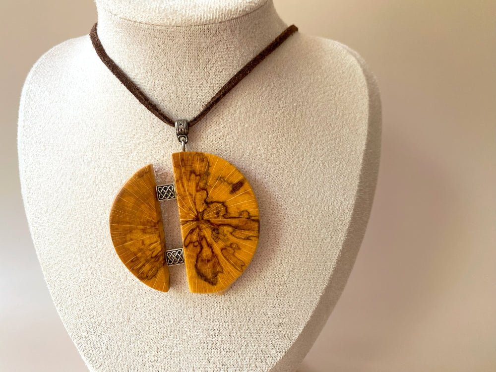 Medium size wooden pendant made from finely polished wood with silver inlays on a woven leather strap - Ornamentico shop