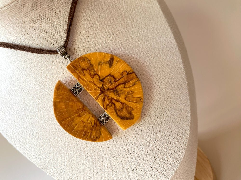 Medium size wooden pendant made from finely polished wood with silver inlays on a woven leather strap - Ornamentico shop
