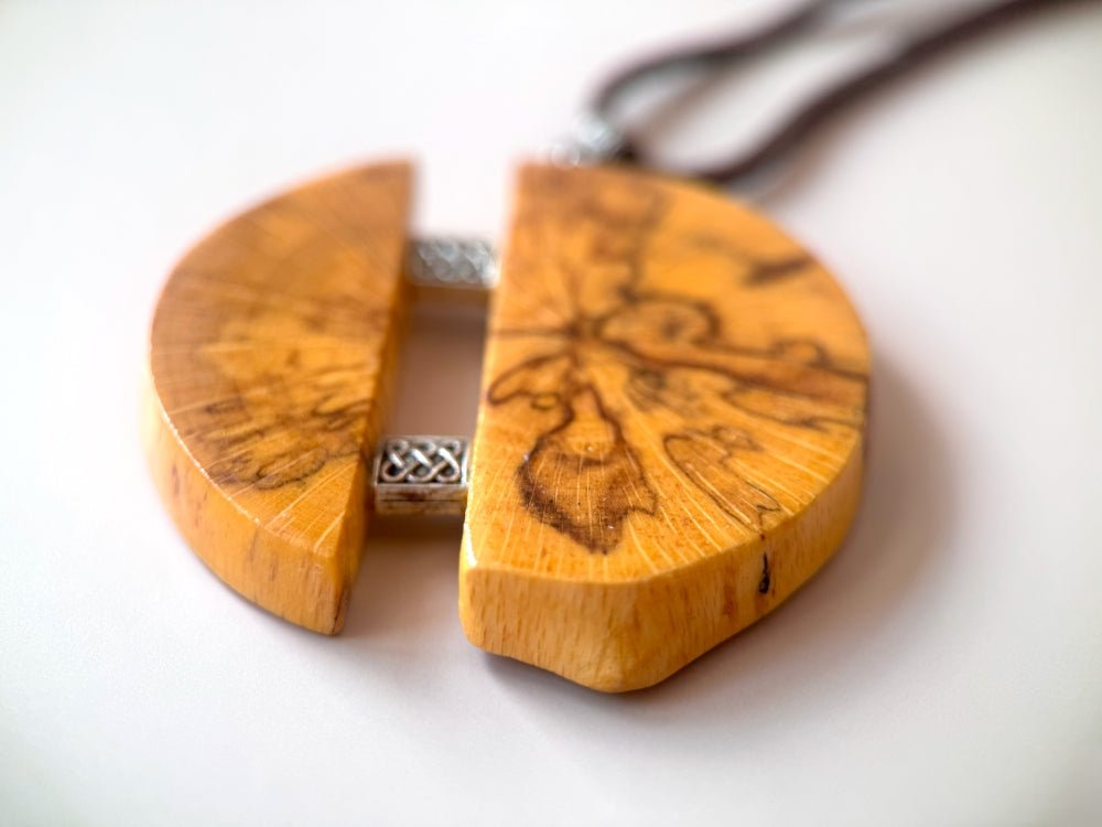 Medium size wooden pendant made from finely polished wood with silver inlays on a woven leather strap - Ornamentico shop